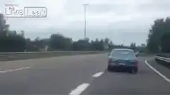 Blue car drifting on highway