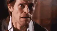Willem Dafoe screaming with tongue out