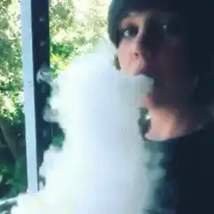 Person exhaling large cloud of vapor