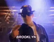 Brooklyn guy adjusting hat