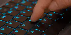 Finger pressing keyboard key