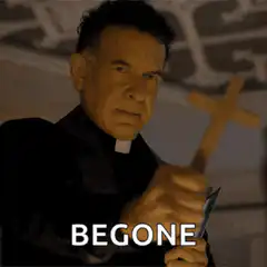 Priest holding cross says begone