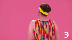 Man in colorful leotard says HEY