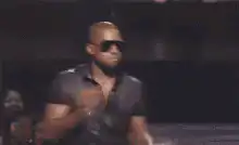 Kanye West dancing on stage