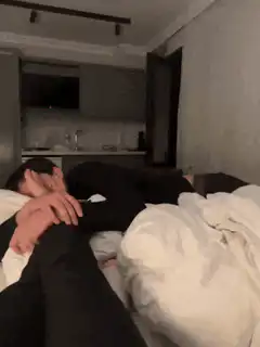 man sleeping with foot on face