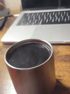 steaming coffee cup on desk