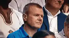 Man in blue shirt says Bollocks just bollock