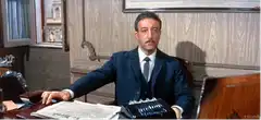 Man tapping fingers on desk