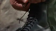 Dutch applying face paint and checking gear