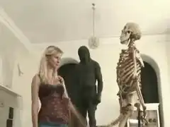 woman slaps skeleton arm