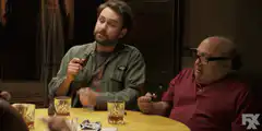 The Deuce cast smoking pipes at a table