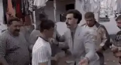 Borat slaps a man in the market