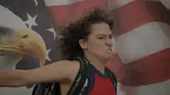Woman saluting with intense expression