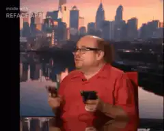 Kevin James with guns in front of city skyline