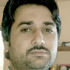 Man with mustache looking at camera