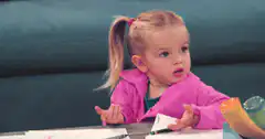 Confused little girl shrugging