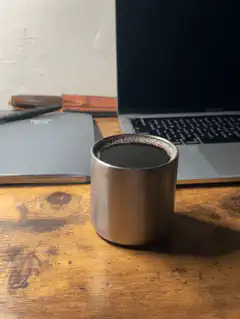Steam rising from a metal cup