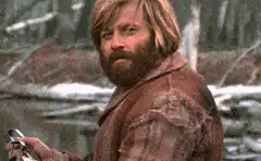 Man with beard smirking