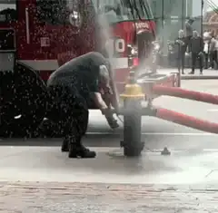 Firefighter knocked over by hydrant