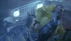 T-Rex eats man in yellow raincoat