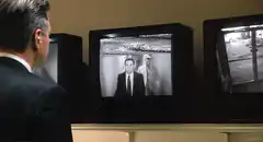 Man watching TV with static