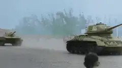 Tank driving past a small child