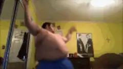 shirtless man dancing in yellow room