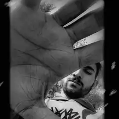man peeking through hand