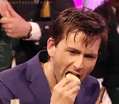 David Tennant eating a cookie