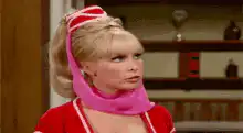 Barbara Eden as Jeannie crosses arms