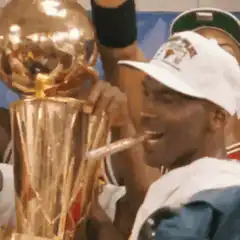Michael Jordan with cigar and championship trophy