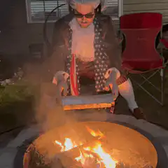 Thomas Jefferson roasting a hot dog