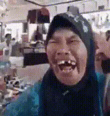 Man laughing hysterically in store