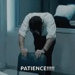 Man gripping chair saying patience
