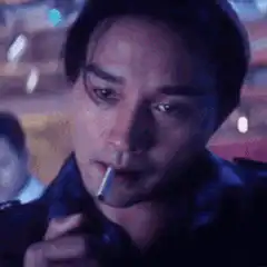 Leslie Cheung lights a cigarette