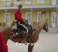Man on horse says peace out