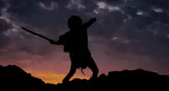 Silhouette warrior with changing weapons