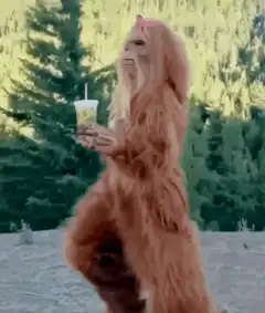 Bigfoot dancing with a drink