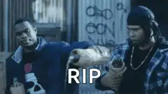 Two men holding a loaf of bread with RIP text