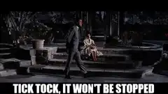 Man walks to woman and sits down