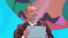 James Acaster reveals purple purse