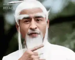 Old man with white beard blows air