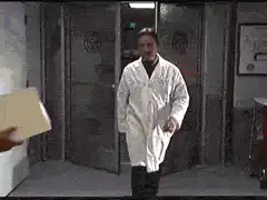 Doctor walks through chaotic hospital hallway