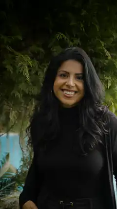 Smiling woman in black outdoors