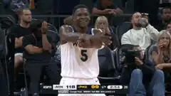 Anthony Edwards clapping on the bench