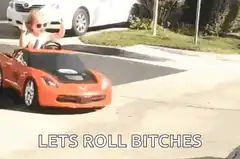 Toddler in toy car lets roll bitches