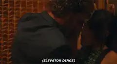 Couple kissing interrupted by elevator dings