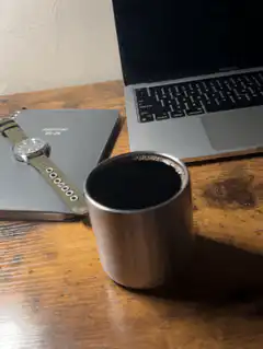 coffee cup on desk with laptop