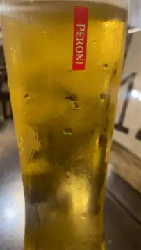Peroni beer glass with bubbles