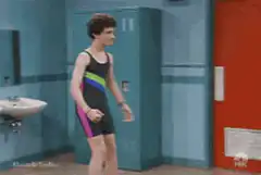 Finn Wolfhard flexing in a swimsuit